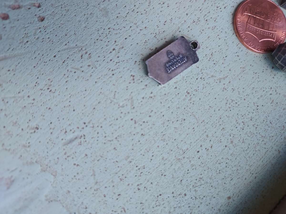 4 charms by the original BELL PHONE COMPANY