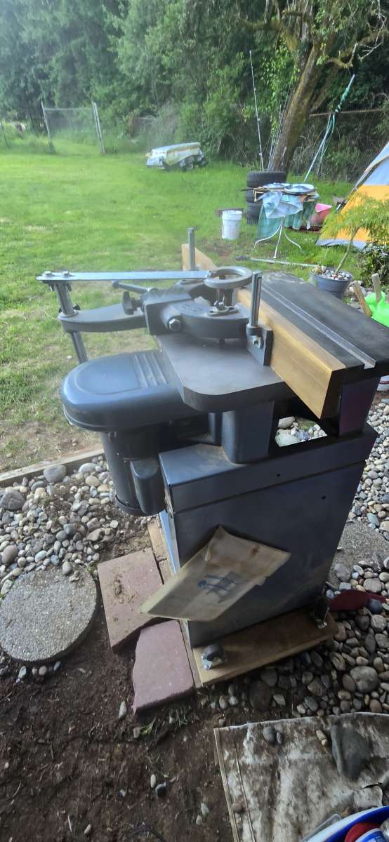 wood shaper with a bunch of bits