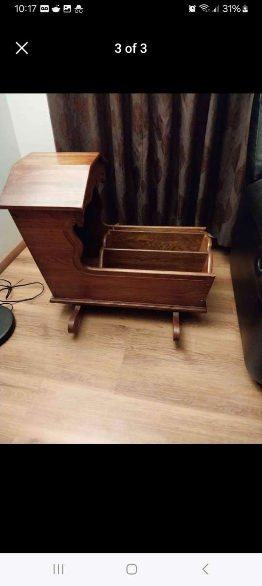 Hooded wooden rocking cradle