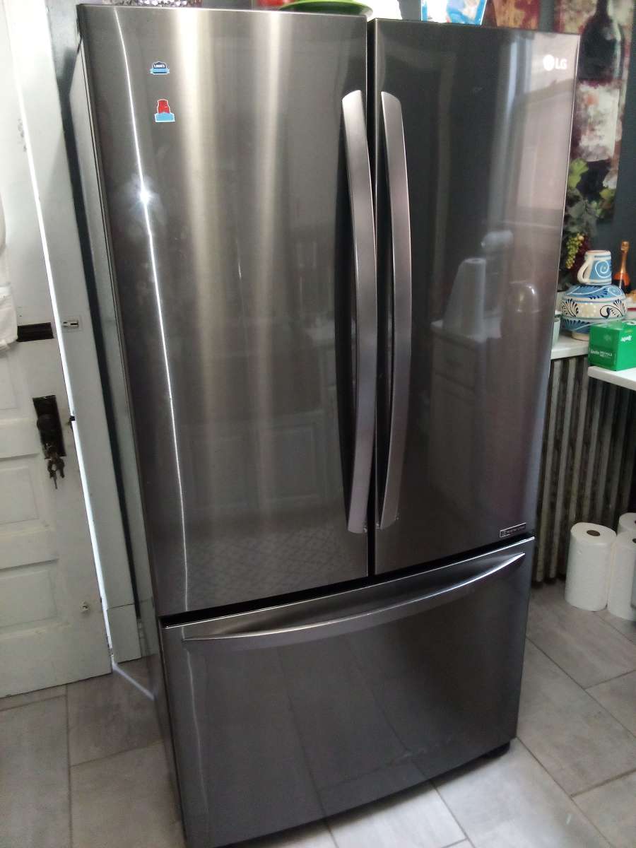 used and half working LG refrigerator