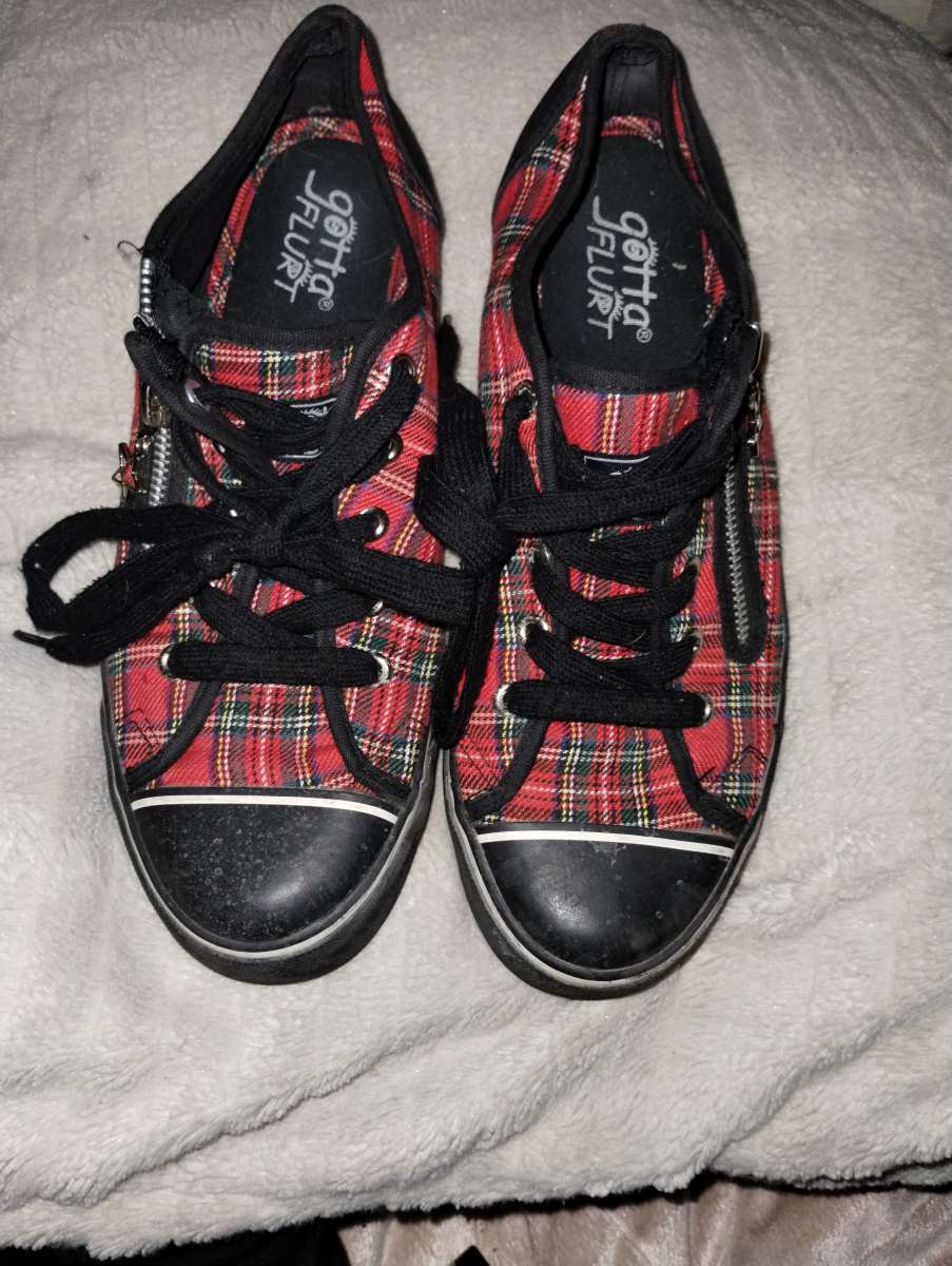 Red and black plaid sneakers by Gotta Flurt