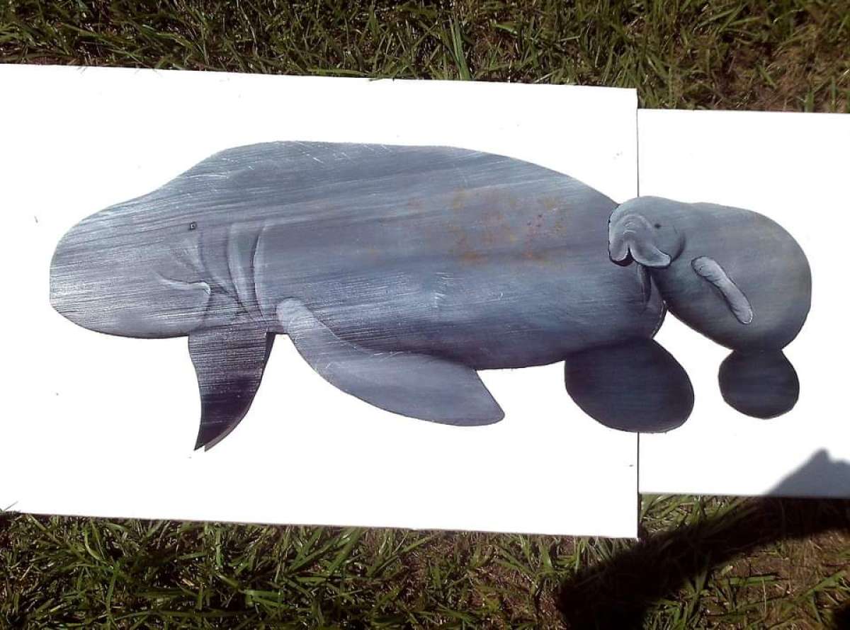 Manatees hand carved palm tree frond art