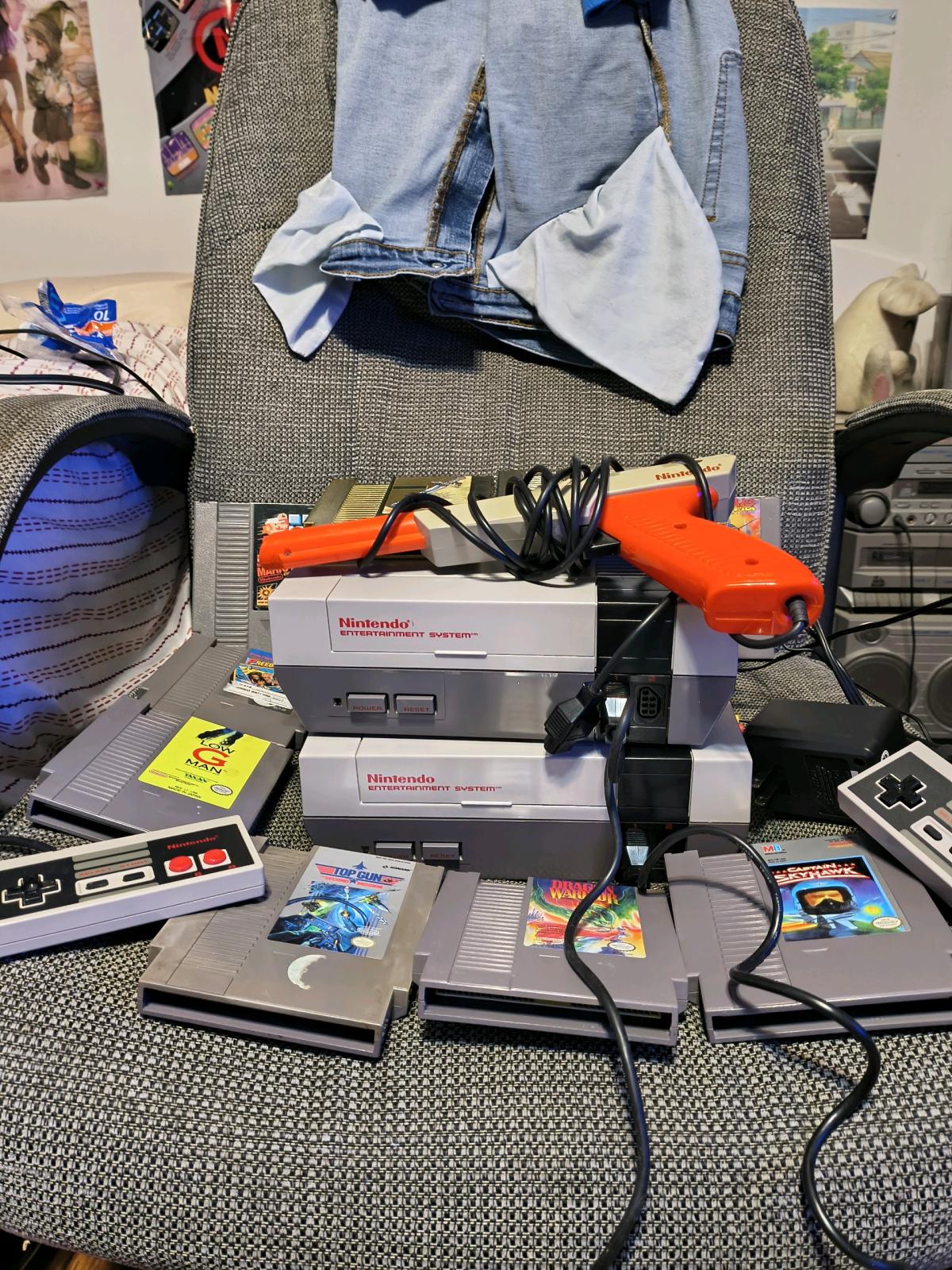 2 Nintendo NES consoles with controllers zapper gun and 11 g