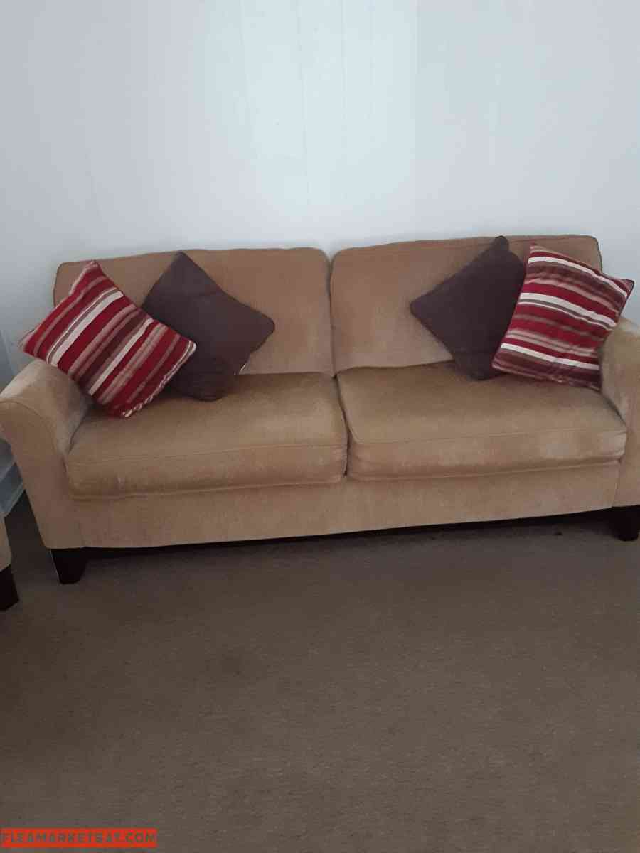 Tan colored sofa & chair set w/ throw pillows