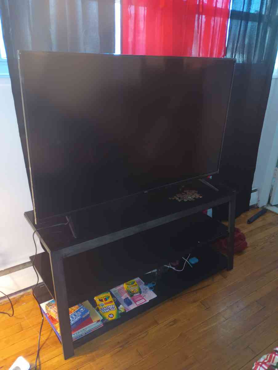60 inch Roku TCL tv Glass TV stand - Poughkeepsie, New York - FleaMarketBay