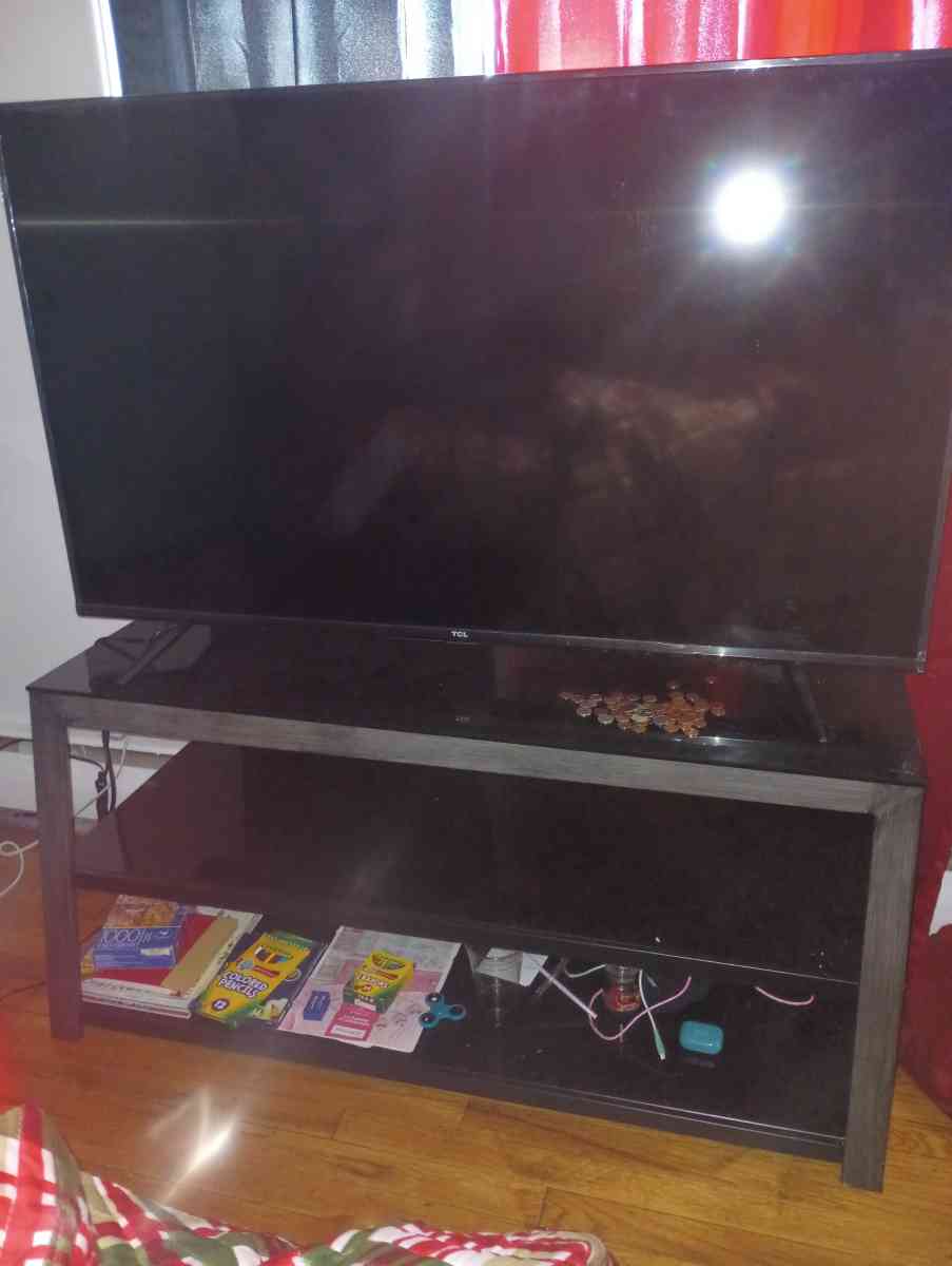 60 inch Roku TCL tv Glass TV stand - Poughkeepsie, New York - FleaMarketBay