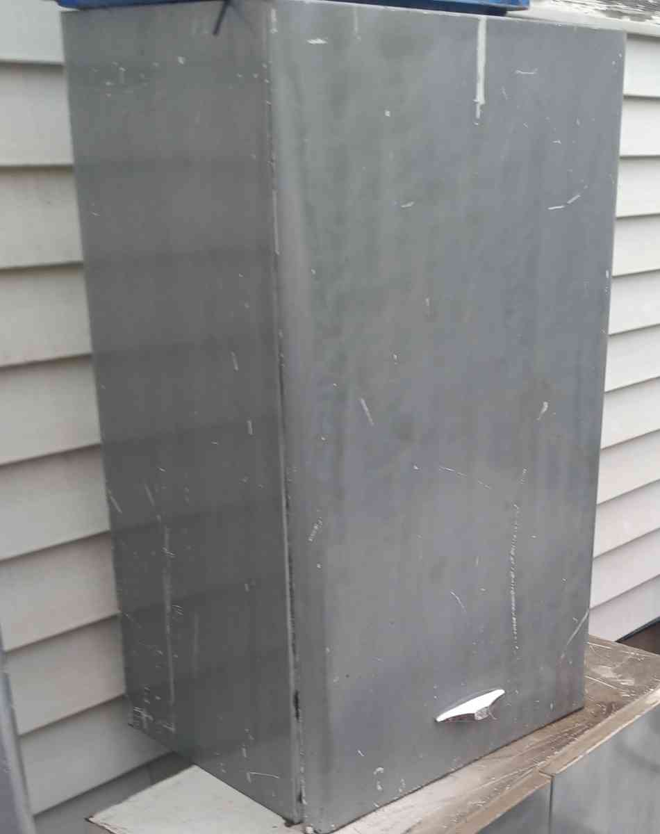 single door metal cabinet with built in shelf