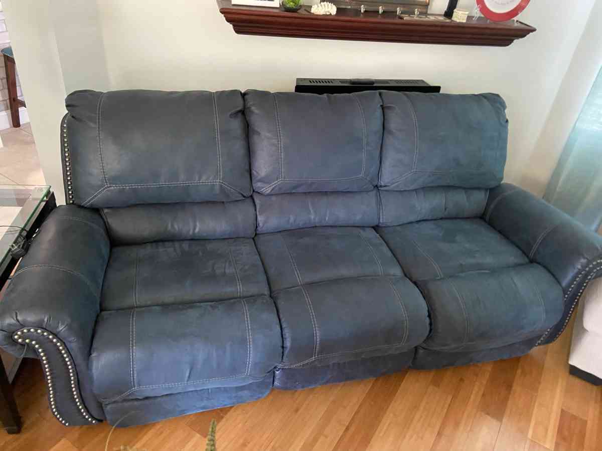 2 leather couches reclines on both sides of each couch - Port Orange, Florida