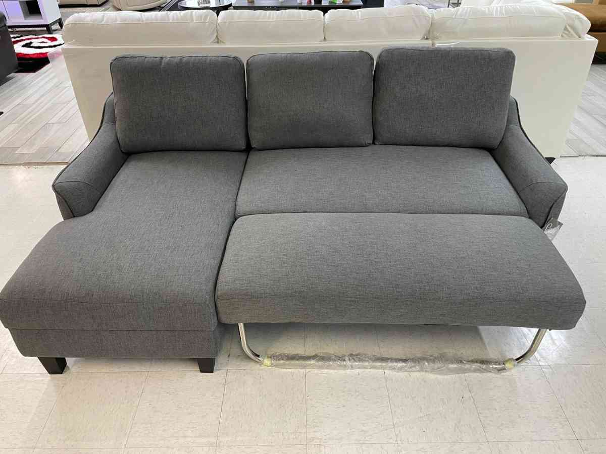 Jarreau aShley Sleeper Sectional in stock  grey on display - Houston, Texas