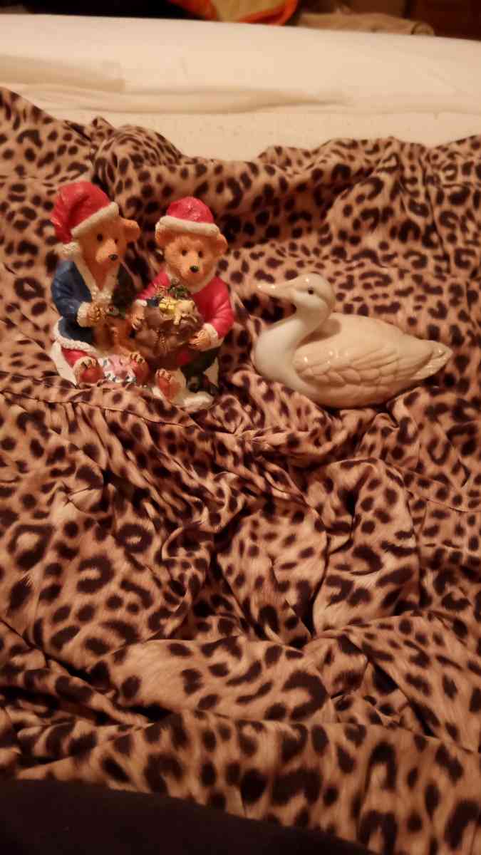 two Christmas teddy bears and one duck