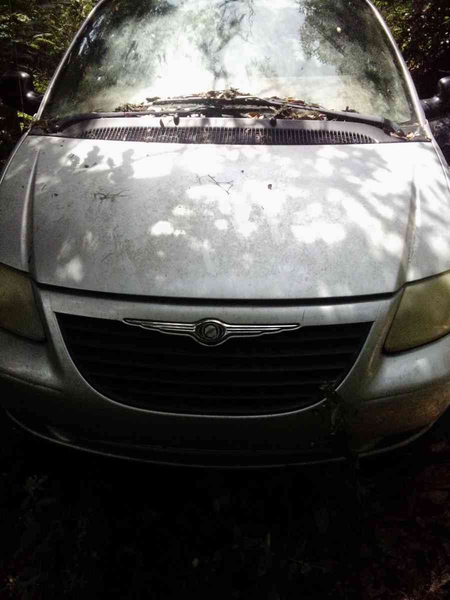 the 2003 Chrysler minivan Voyager for sale needs a little wo - Lake Butler, Florida - FleaMarketBay