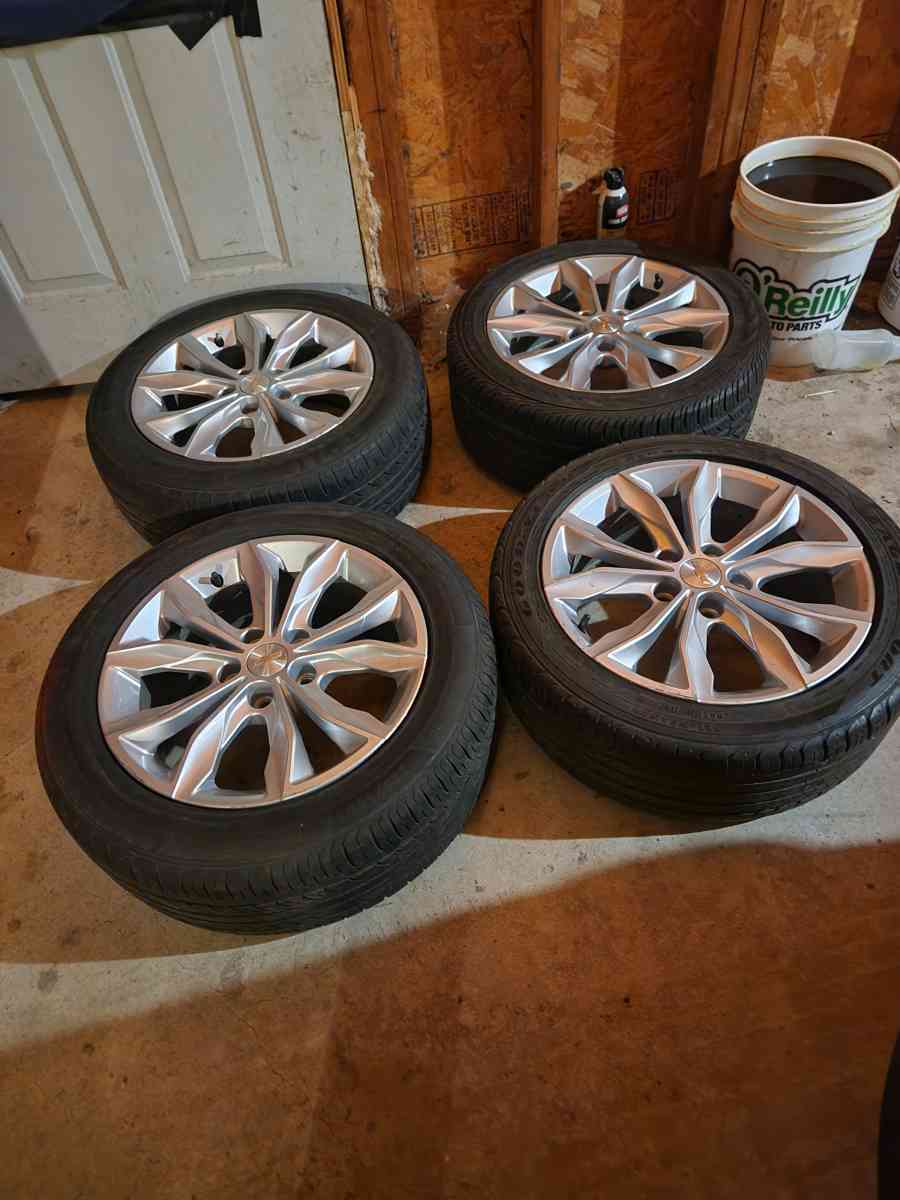 A set of 4 17 inch rims and tires - Rochelle, Illinois