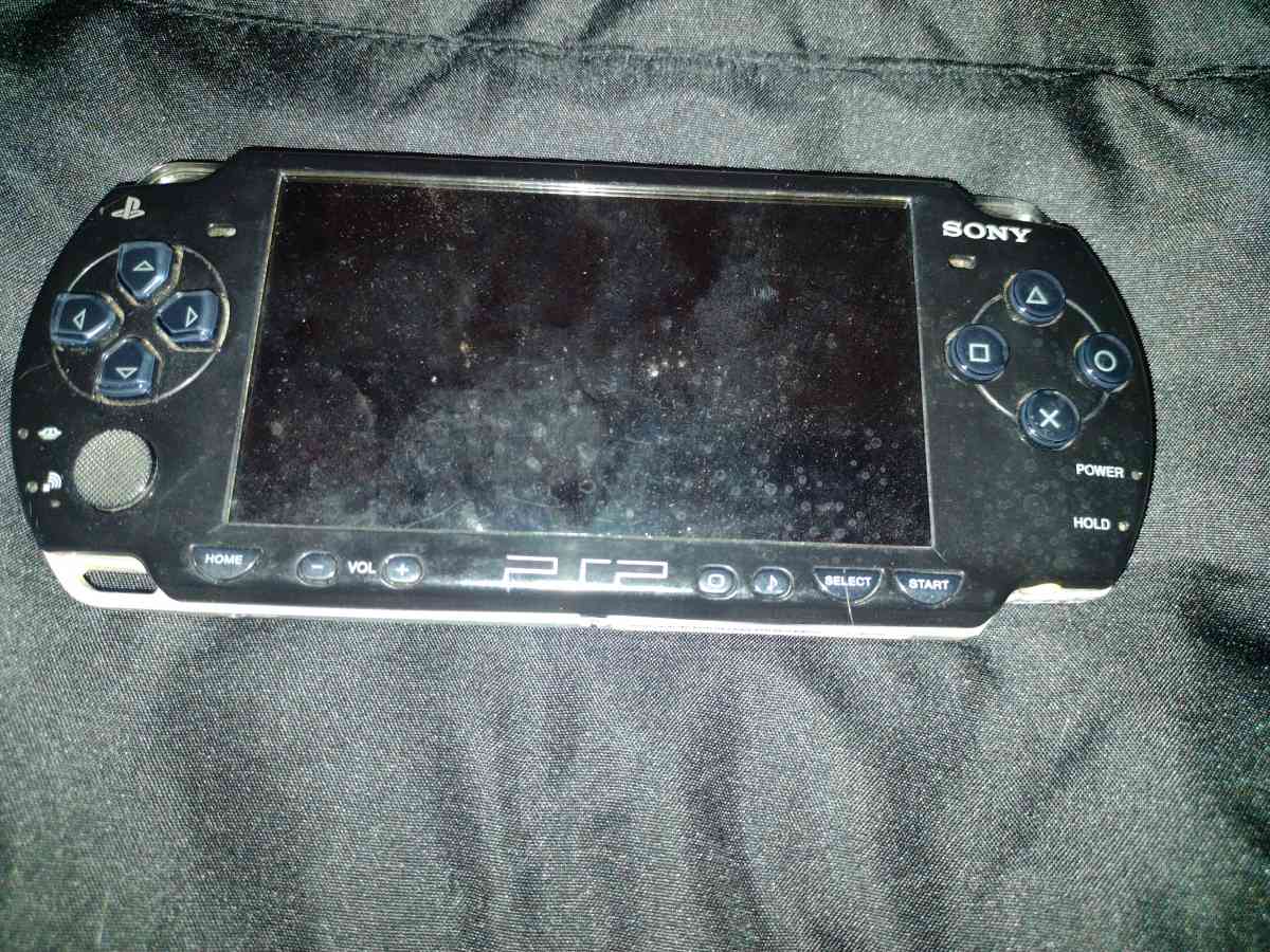psp with charger and two games - Covina, California