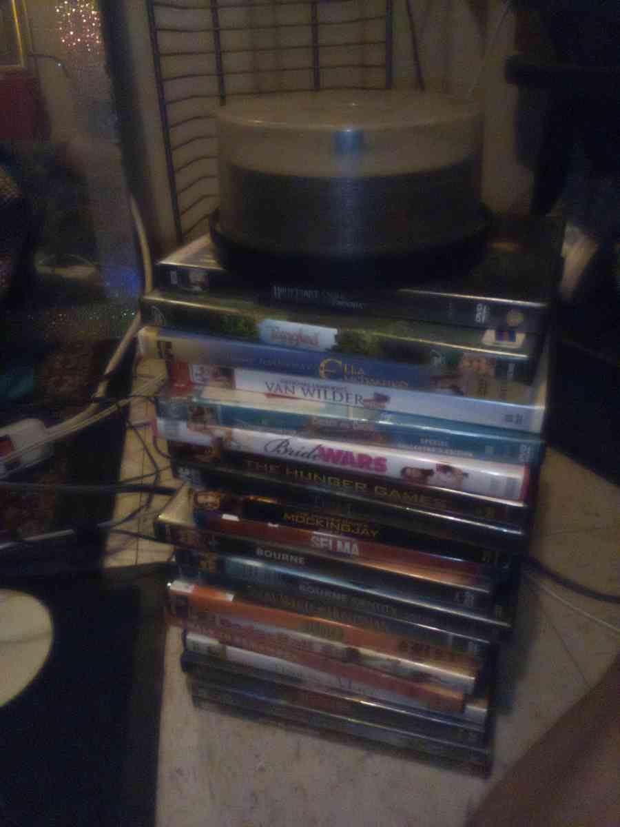several DVDs and a big DVD holder - Wichita Falls, Texas