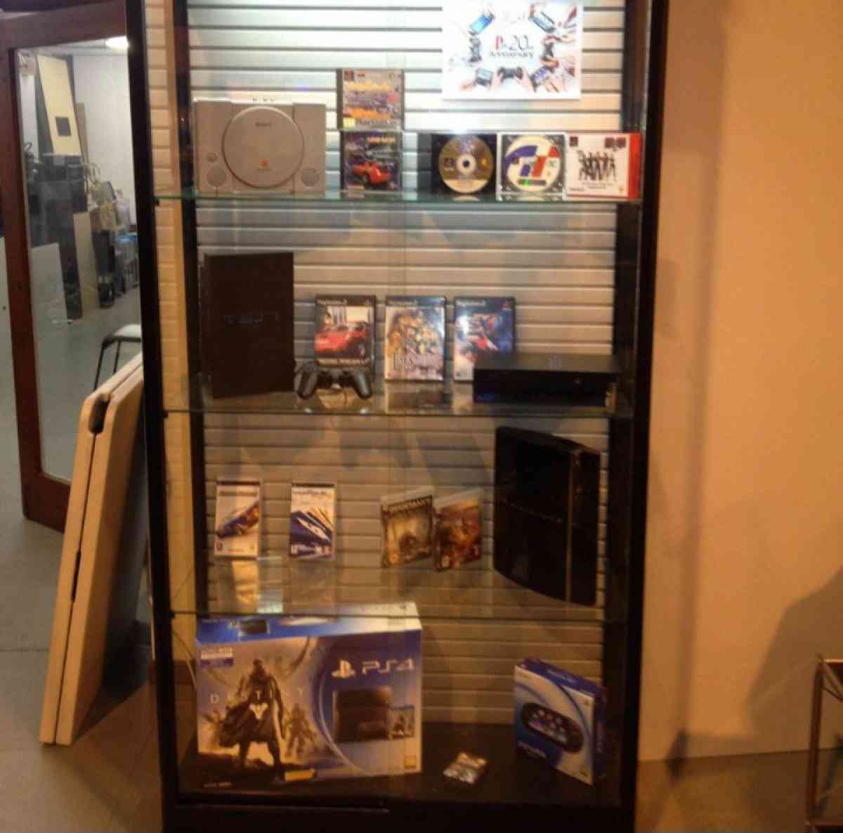 Playstation showcase with games - Mccomb, Mississippi - FleaMarketBay