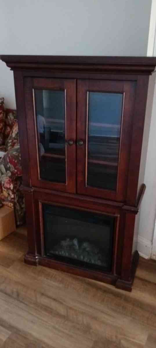 Wood curio cabinet with electric fireplace - Philadelphia, Pennsylvania