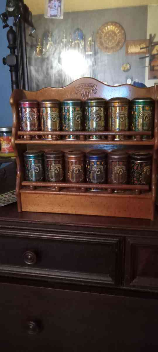 vintage spice cabinet with metal spice tins - New Albany, Indiana