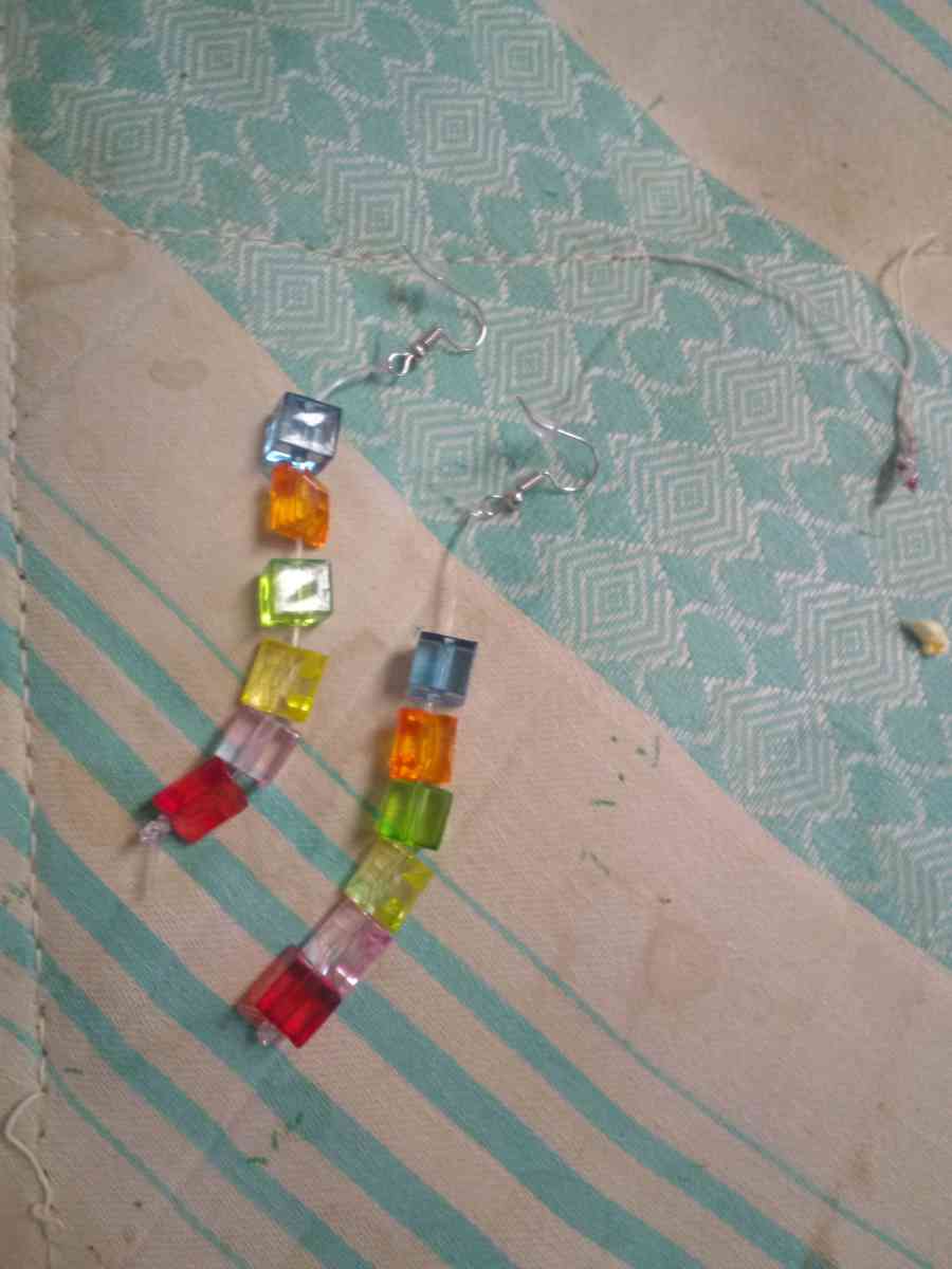 a religious wall hanging and two pairs of hand made earrings - Miller, South Dakota - FleaMarketBay