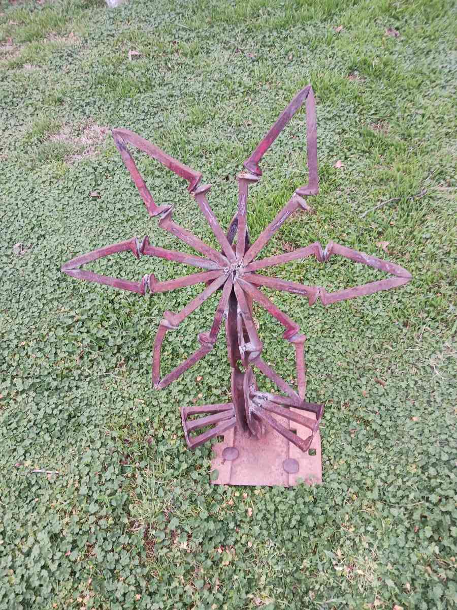 yard art flower made it out of train track spikes 65 for it - Iowa Park, Texas - FleaMarketBay
