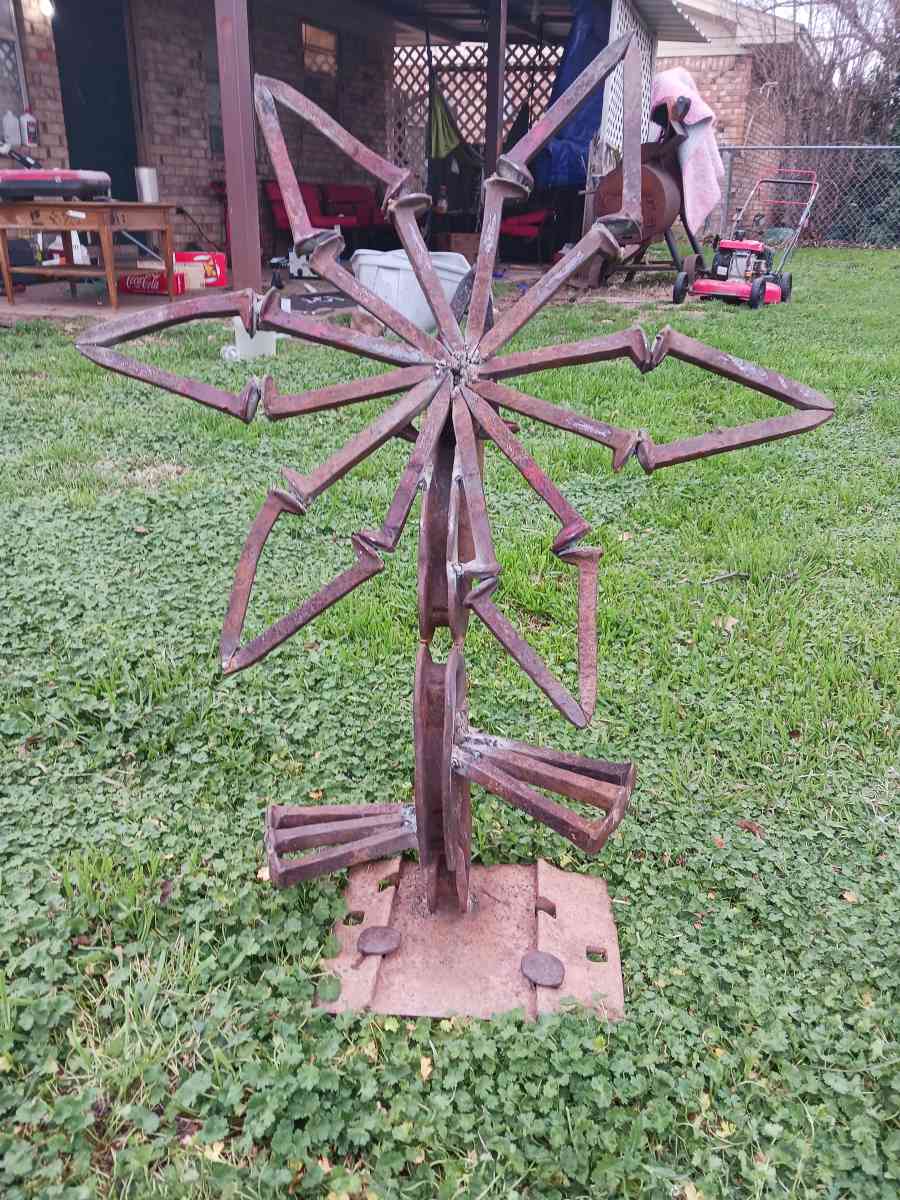 yard art flower made it out of train track spikes 65 for it - Iowa Park, Texas - FleaMarketBay