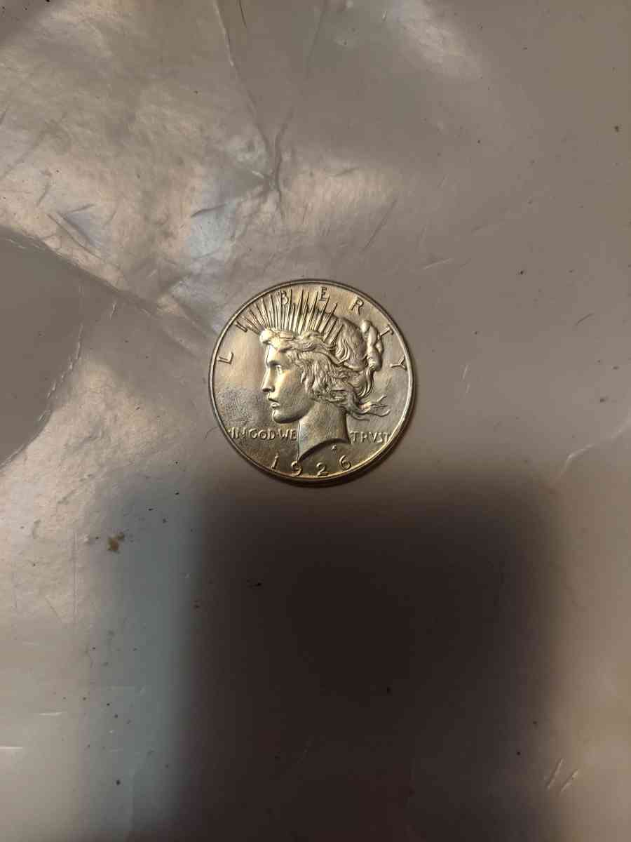 This is a nineteen twenty six s peace dollar Van four harder - Goodrich, Texas - FleaMarketBay