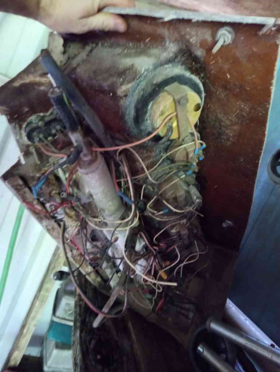 old boat parts and fishing poles and tackle