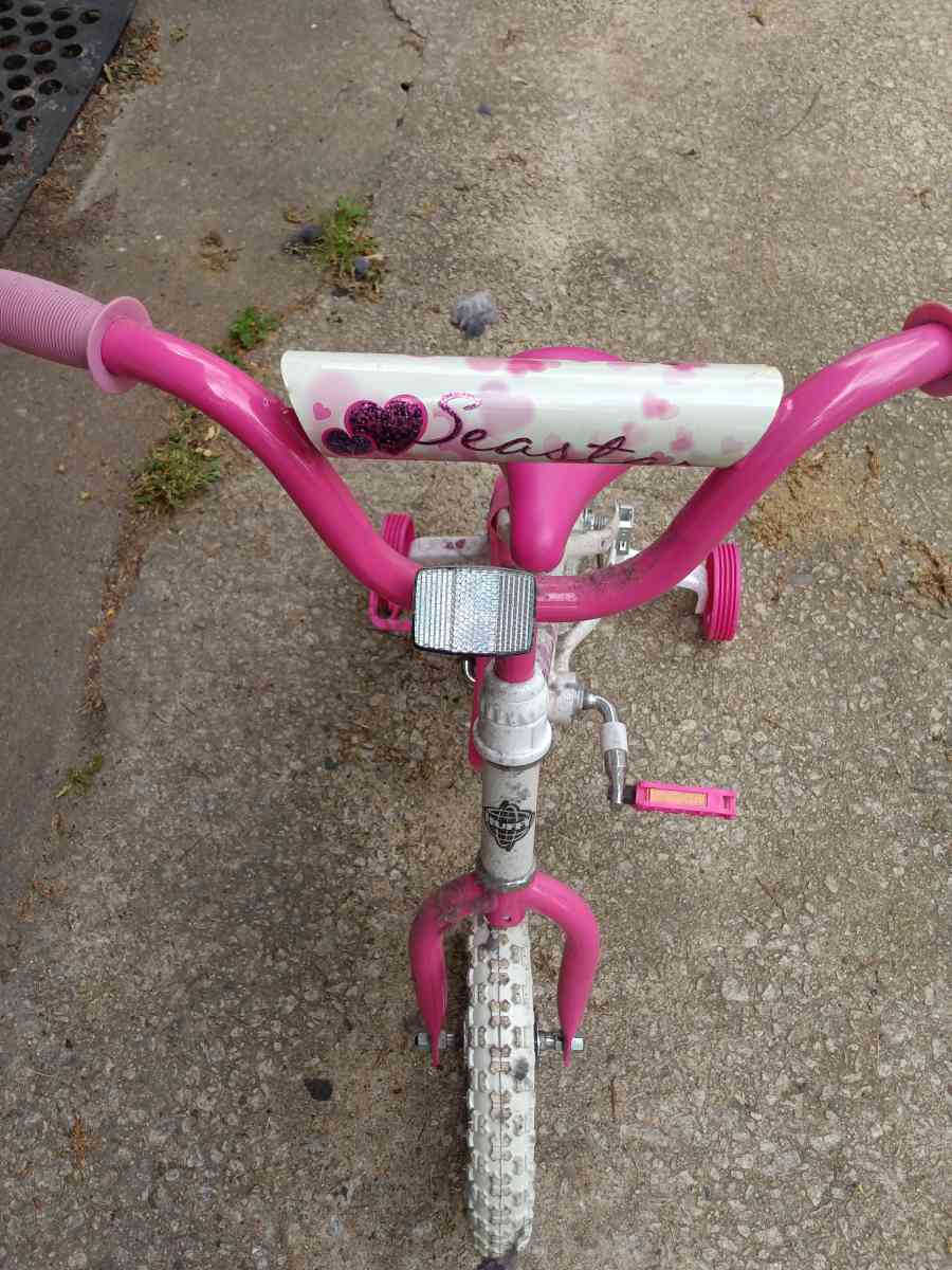 a healthy Barbie pink and white bike with training wheels - Winston Salem, North Carolina - FleaMarketBay