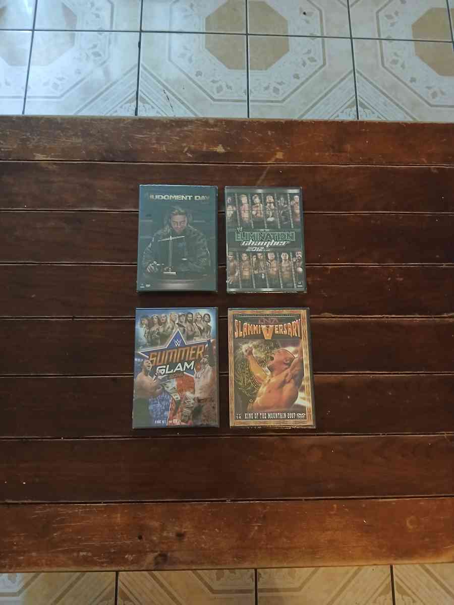 Lot Of 8 WWE And TNA DVDs - North Hollywood, California - FleaMarketBay