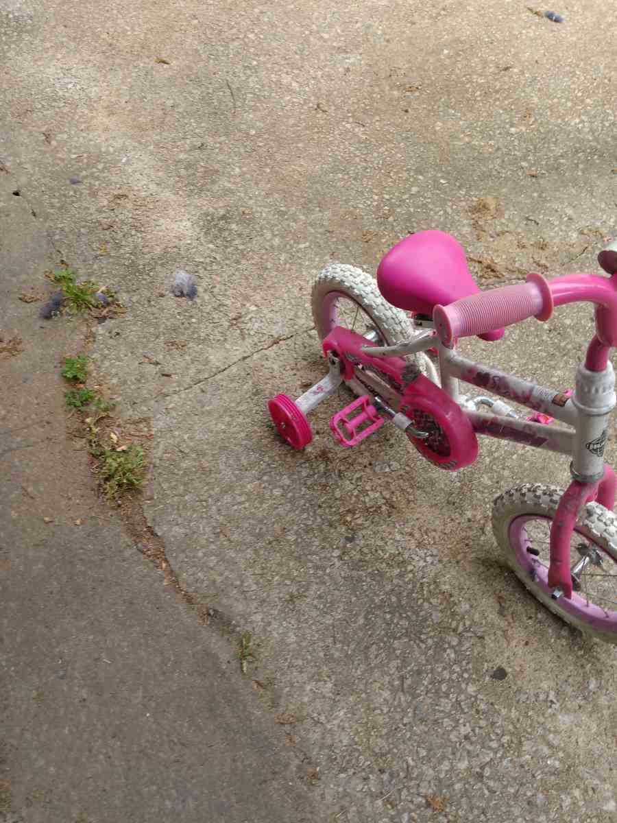 a healthy Barbie pink and white bike with training wheels - Winston Salem, North Carolina