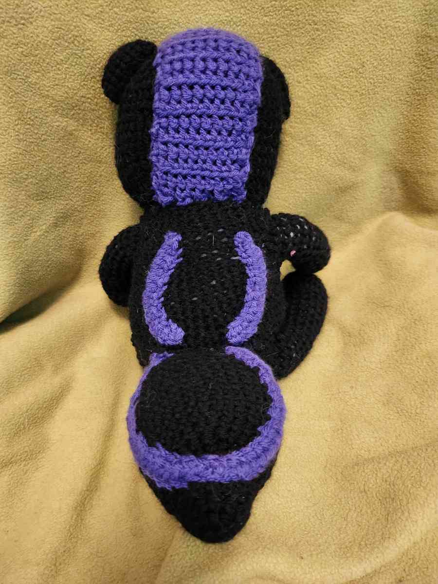 Spunky the black and purple Skunk - Roseburg, Oregon