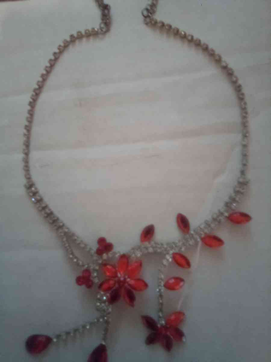 Orange hanging flower and gold necklace with diamonds - Jacksonville, Florida