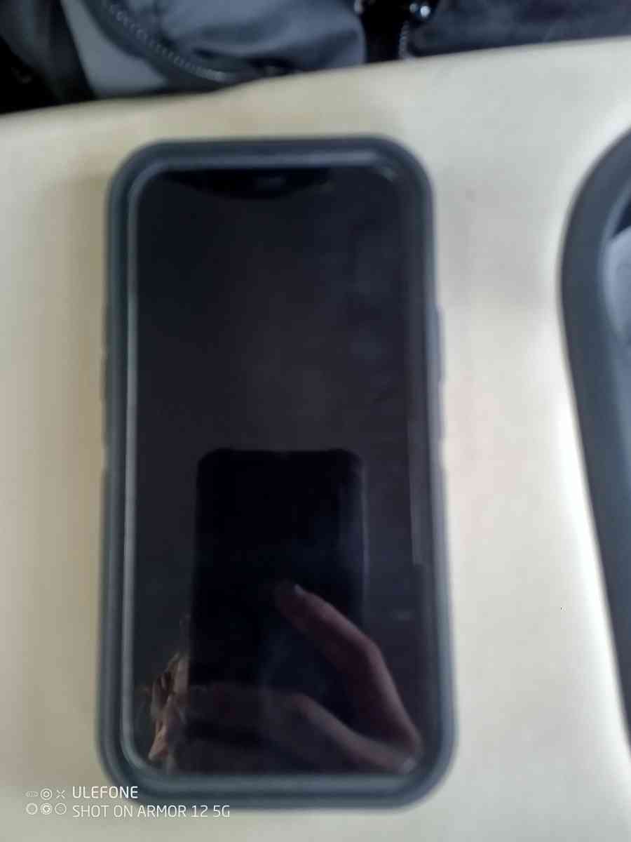 Black iPhone 12 With Black OtterBox Case - Lafayette, Louisiana - FleaMarketBay