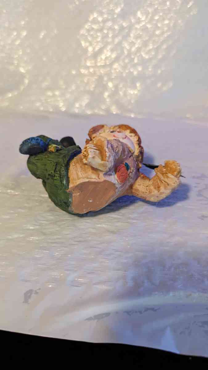 Resin Scarecrow Laying Down With Legs Bent Holding A Crow - Phoenix, Arizona - FleaMarketBay