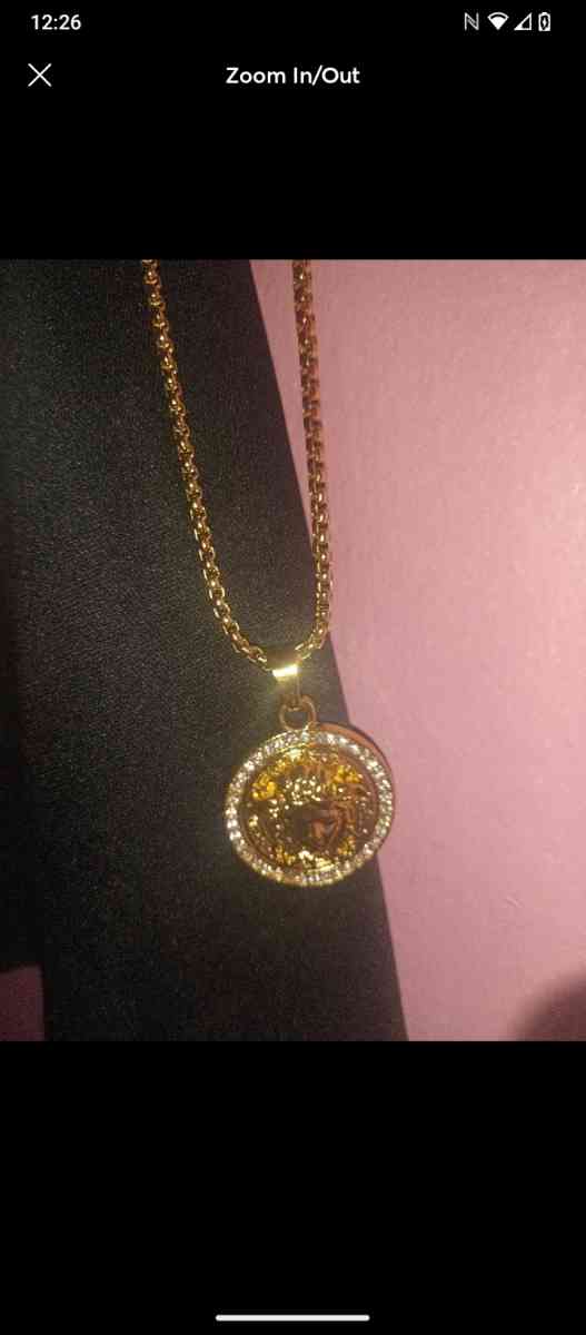 Gold V Medusa necklace