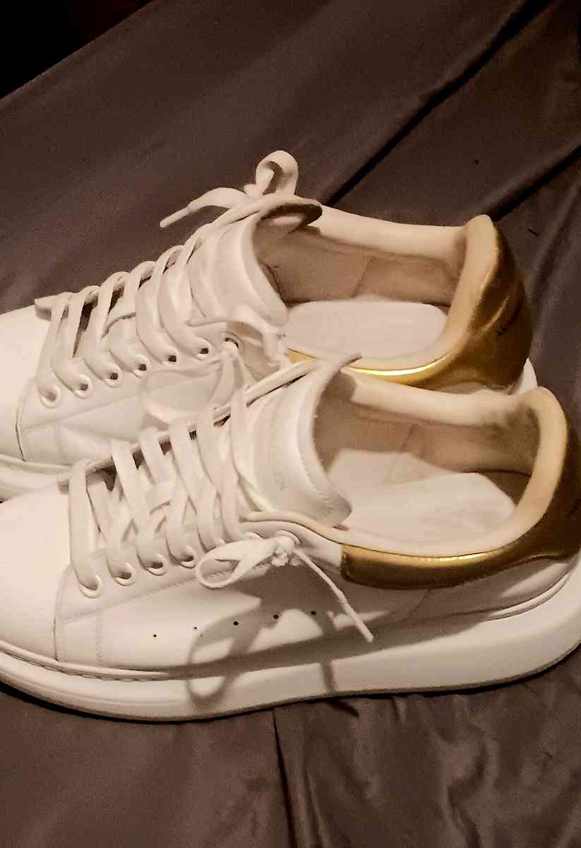 a pair of Alexander McQueen sneakers  size 9