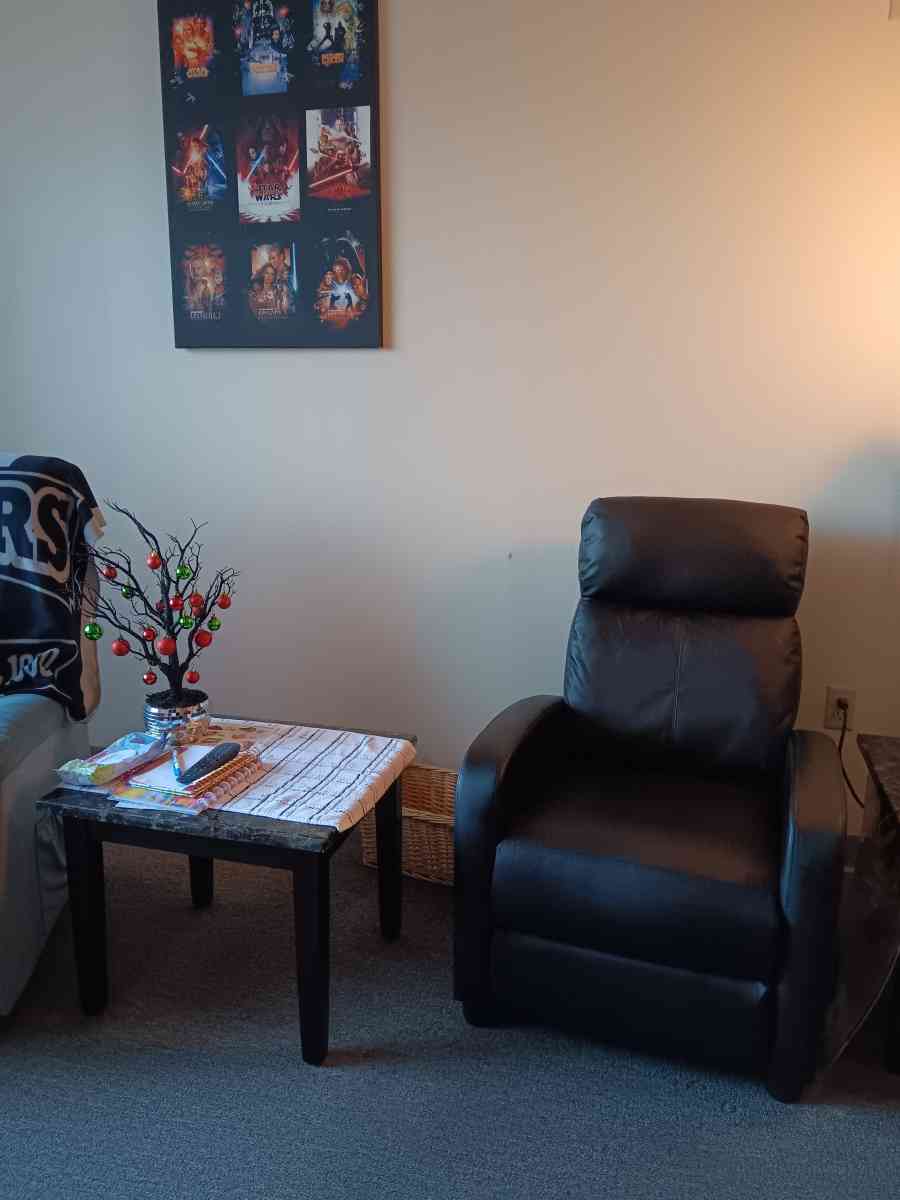 Black leather recliner with foot