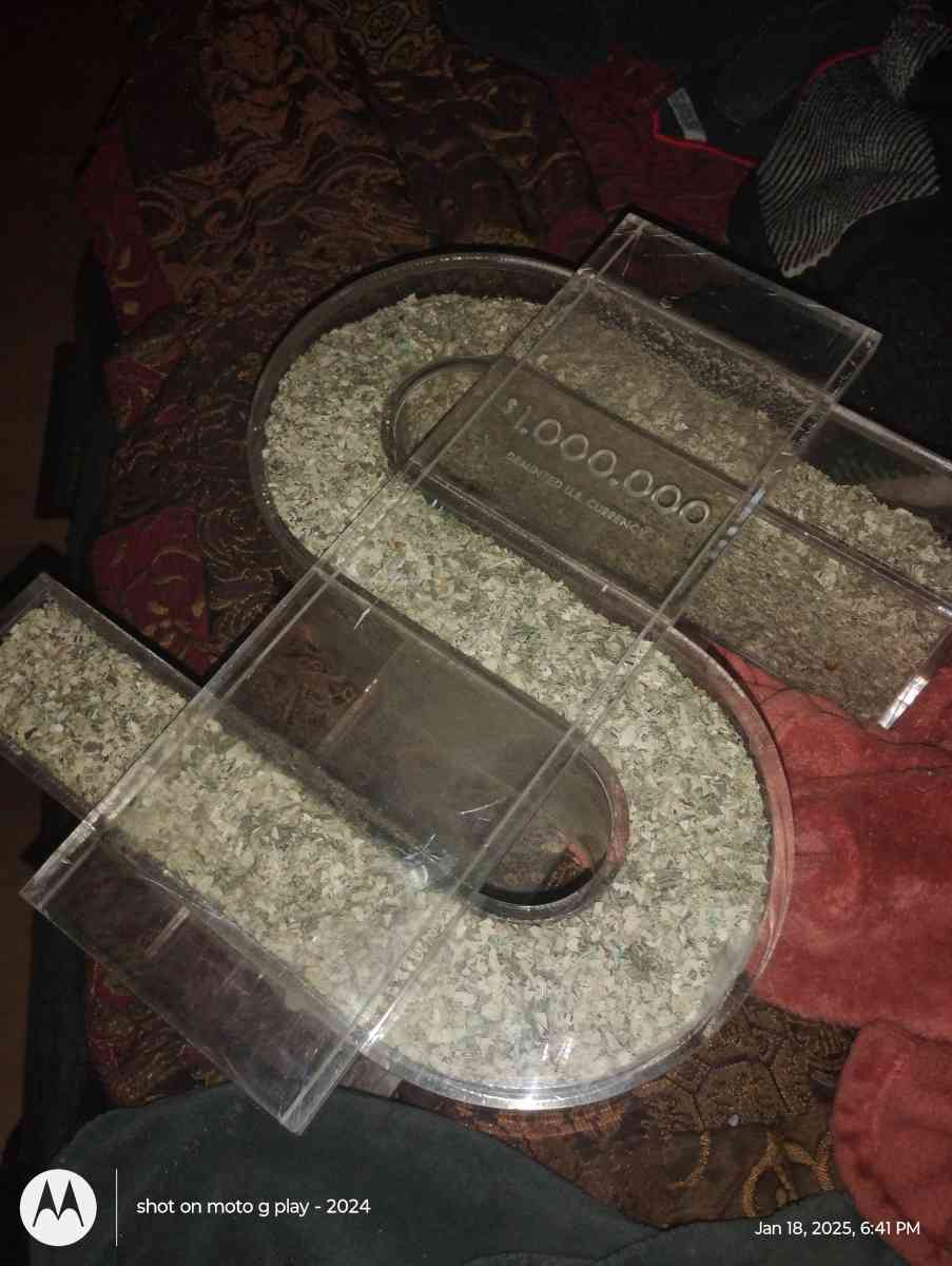 1 million dollars in a plastic money symbol container - Pine Grove, Louisiana