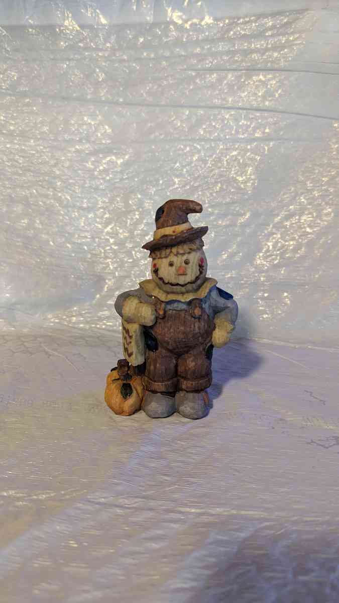 Happy Wood Scarecrow has a couple of Pumpkins and a little S - Phoenix, Arizona