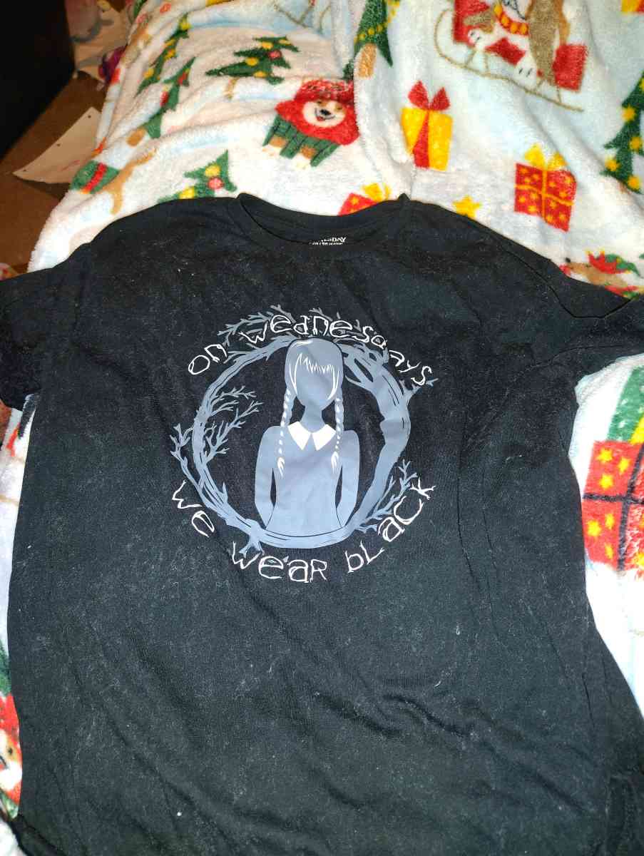 a shirt that says on Wednesday we wear black