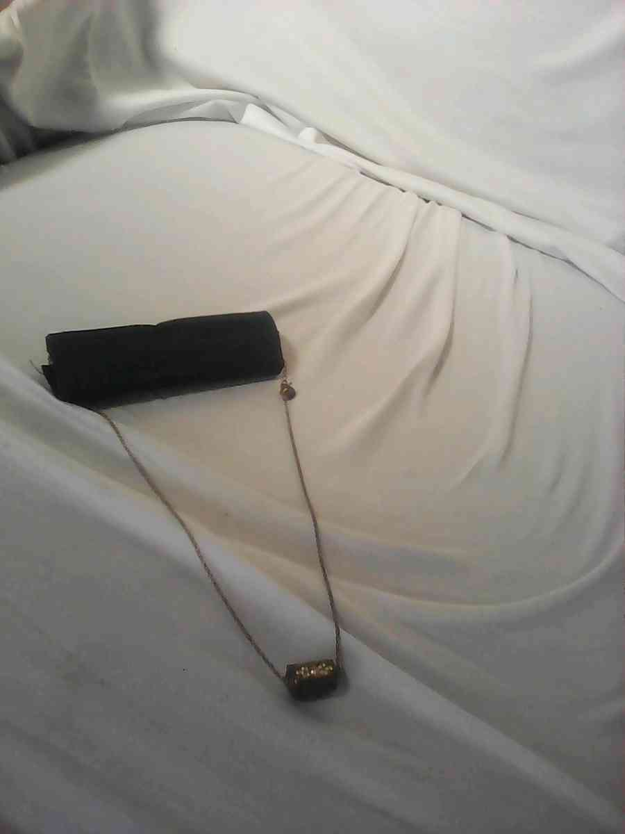 silver girl and woman necklace needs cleaning