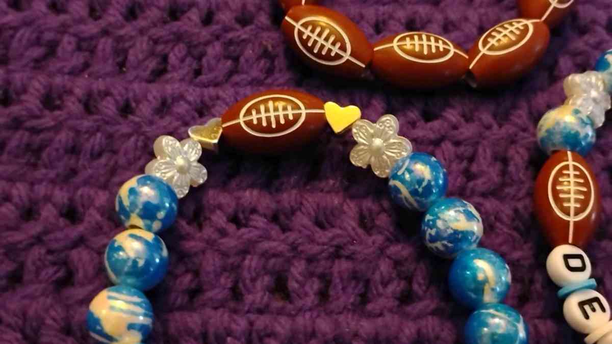 Football bracelet with blue accent beads