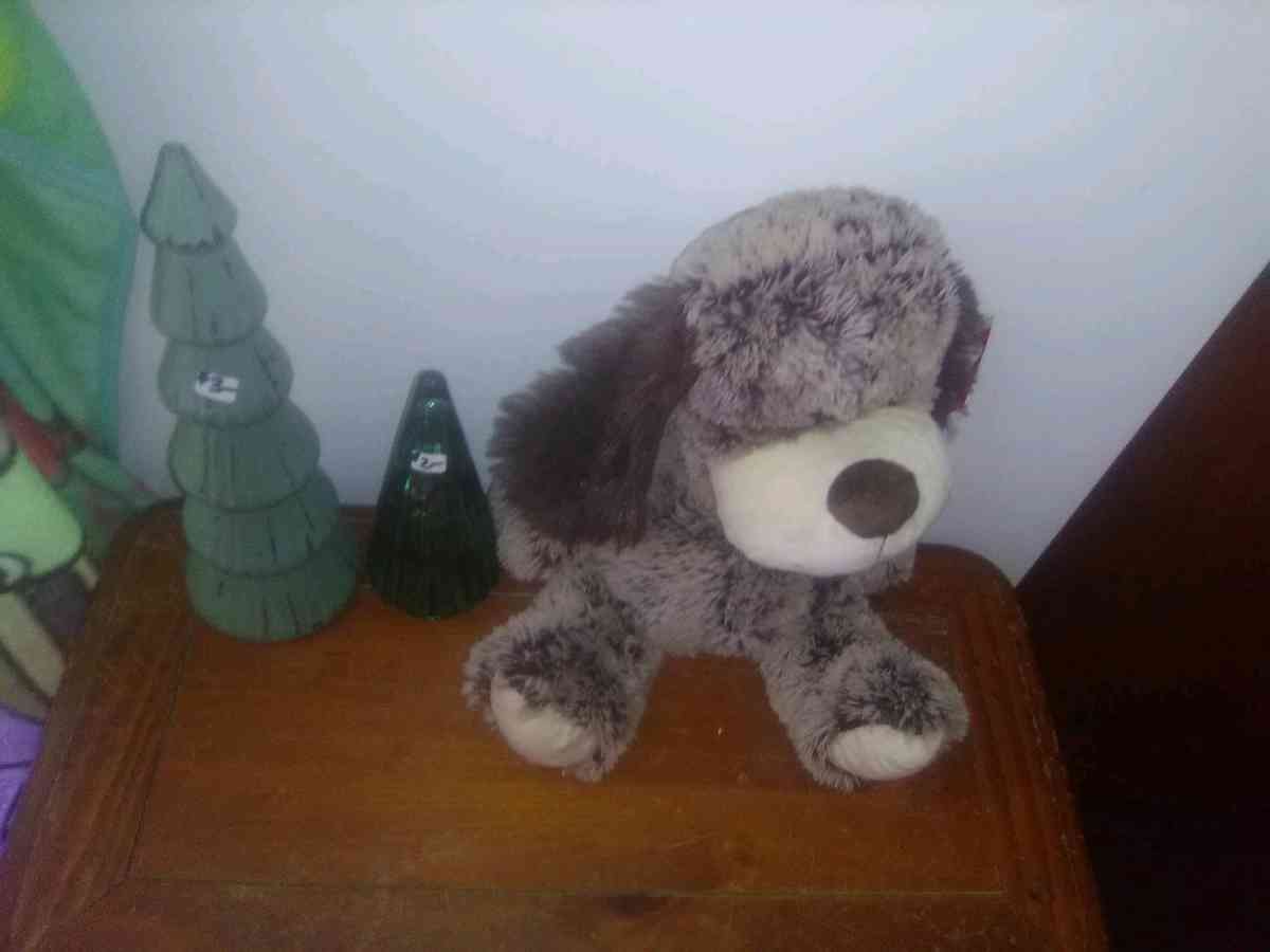 stuffed dog two Christmas trees