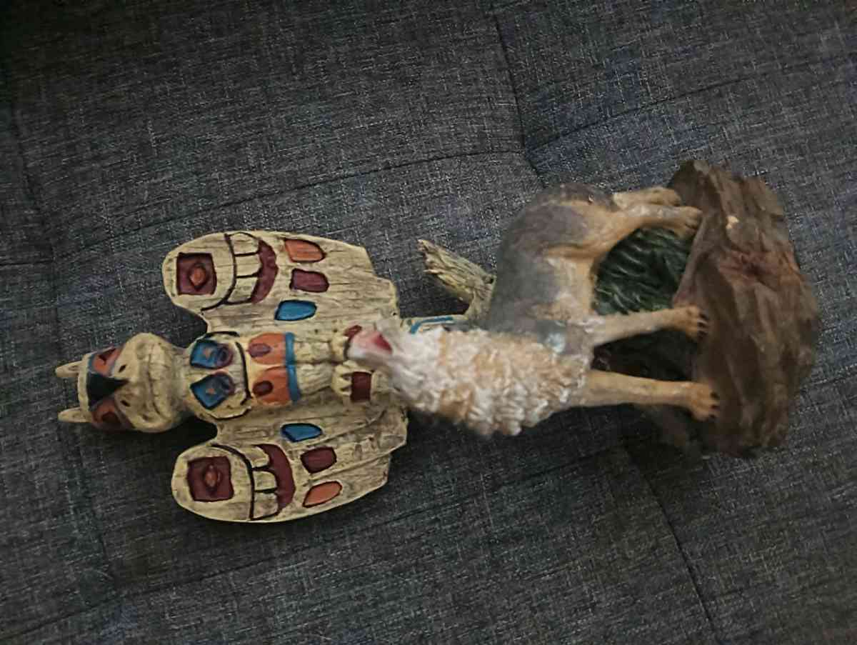 wolf and tiki statue