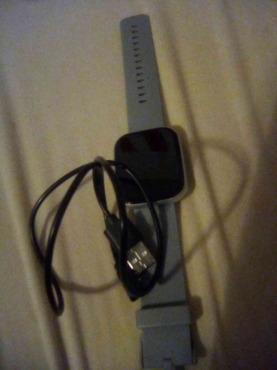 a Fitbit watch and it tells time - Mount Gilead, Ohio