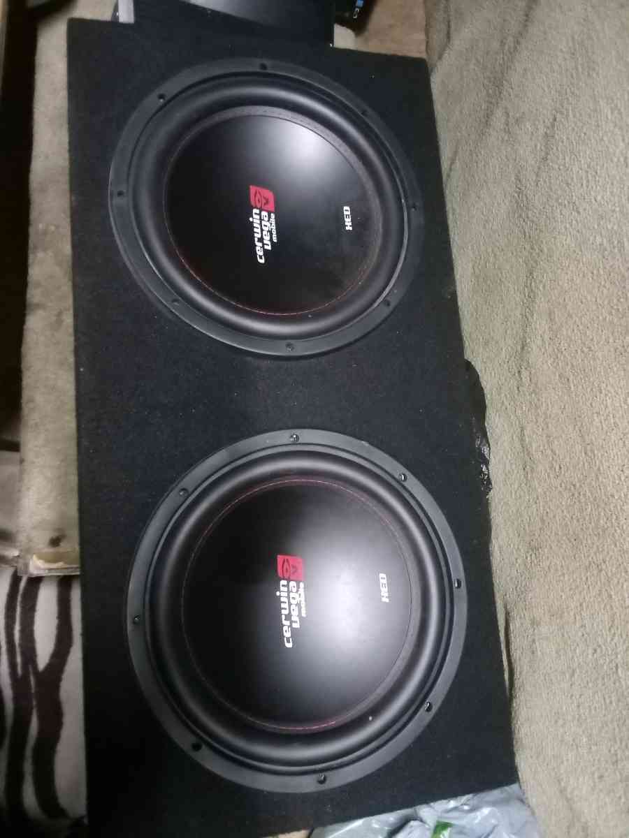 Two 12 inch Cerwin Vega subwoofers and a 1000w4 channel amp
