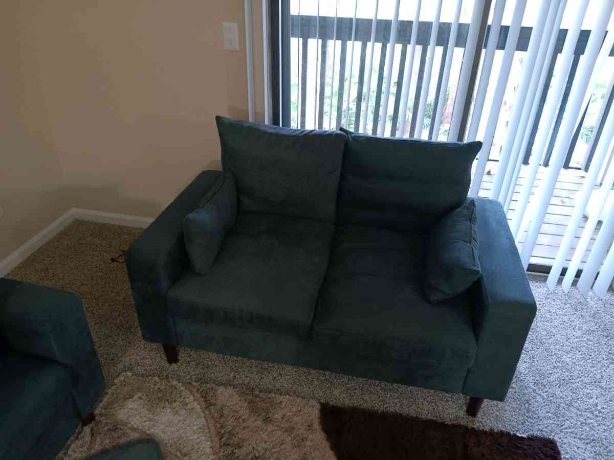 couch and loveseat and cabinet with glass shelves very clean - Jacksonville, Florida