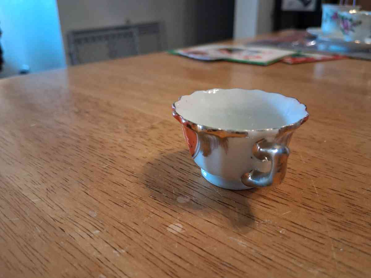 orange and pink flower design tiny teacup - Comstock, Michigan - FleaMarketBay