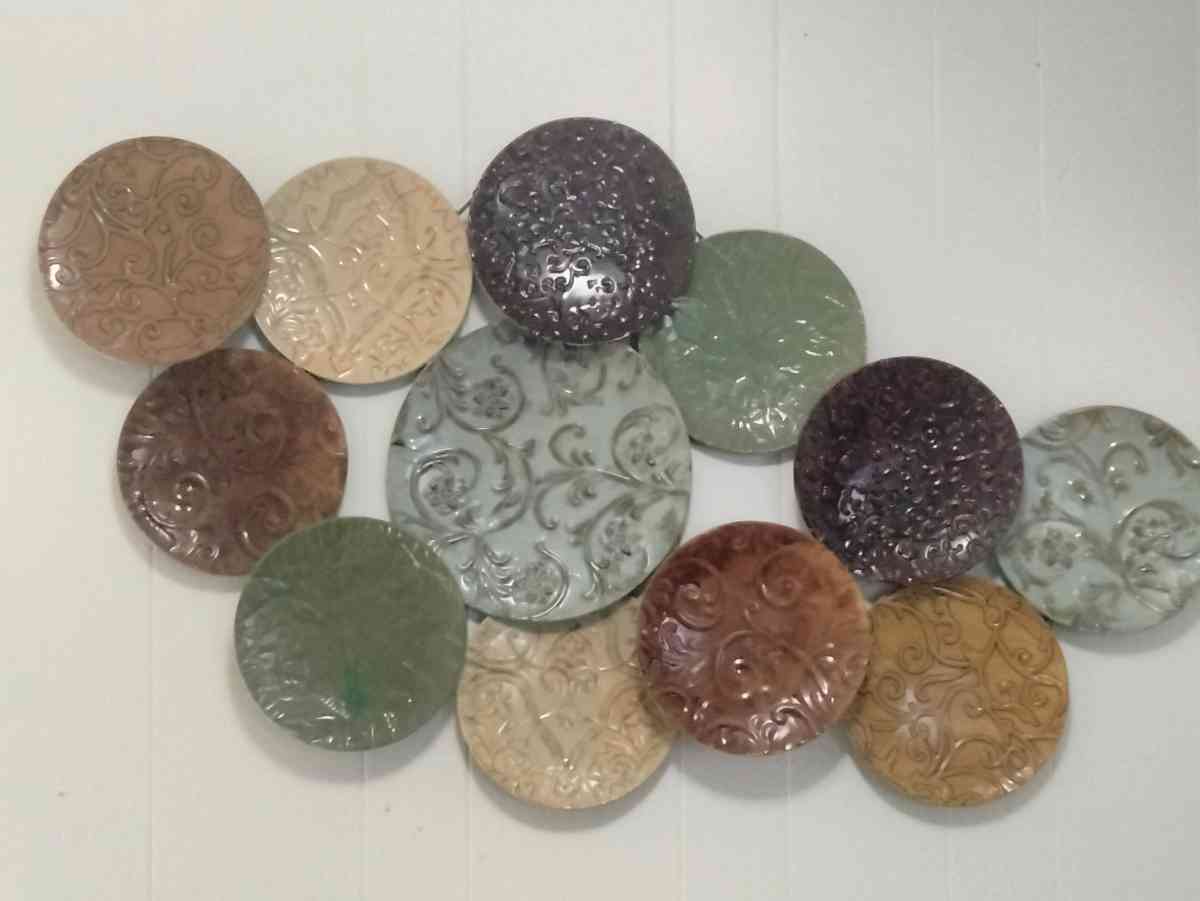 multi colored embossed metal plates wall decor