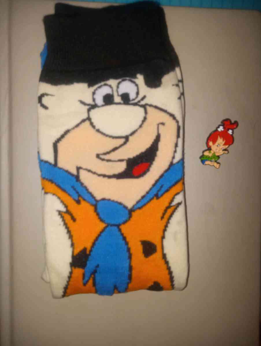 Fred Flintstone socks collectible with a pebbles pin
