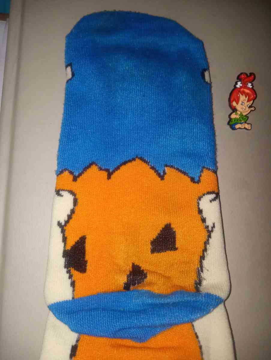 Fred Flintstone socks collectible with a pebbles pin - Merry Hill, North Carolina - FleaMarketBay